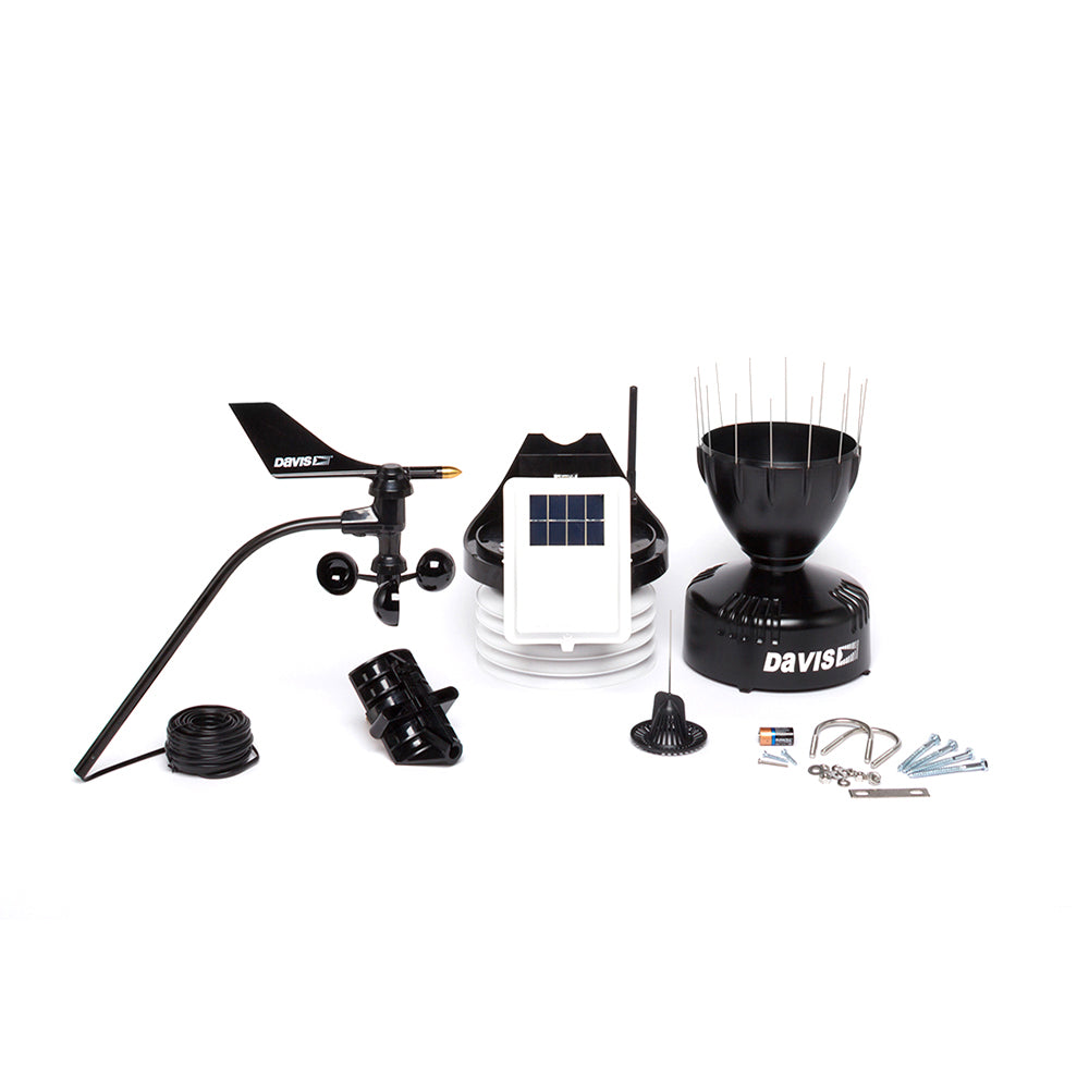 A black Davis 6322 Wireless Integrated Sensor Suite w-Standard Radiation Shield with a solar panel and other accessories.