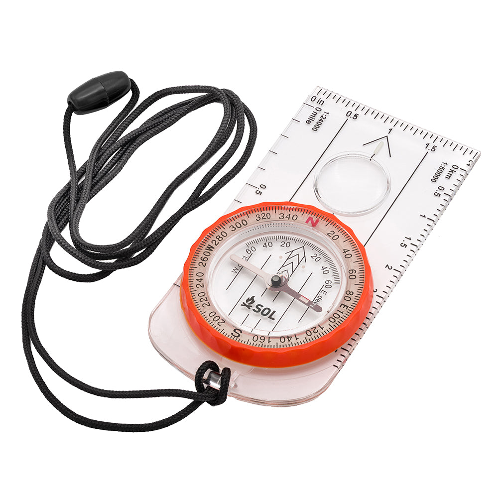 A S.O.L. Survive Outdoors Longer Deluxe Map Compass with a cord attached to it.