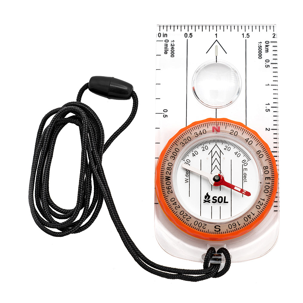 A S.O.L. Survive Outdoors Longer Deluxe Map Compass with a cord attached to it.