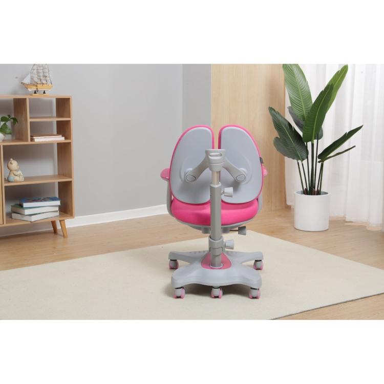 A Smiley Ergonomic Height Adjustable Kids Chair (Pink) with wheels in a room.