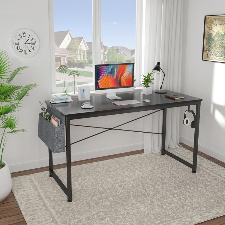 A 47 inch Modern Simple Style Computer Desk Office Desk Study Desk with a plant in front of it.