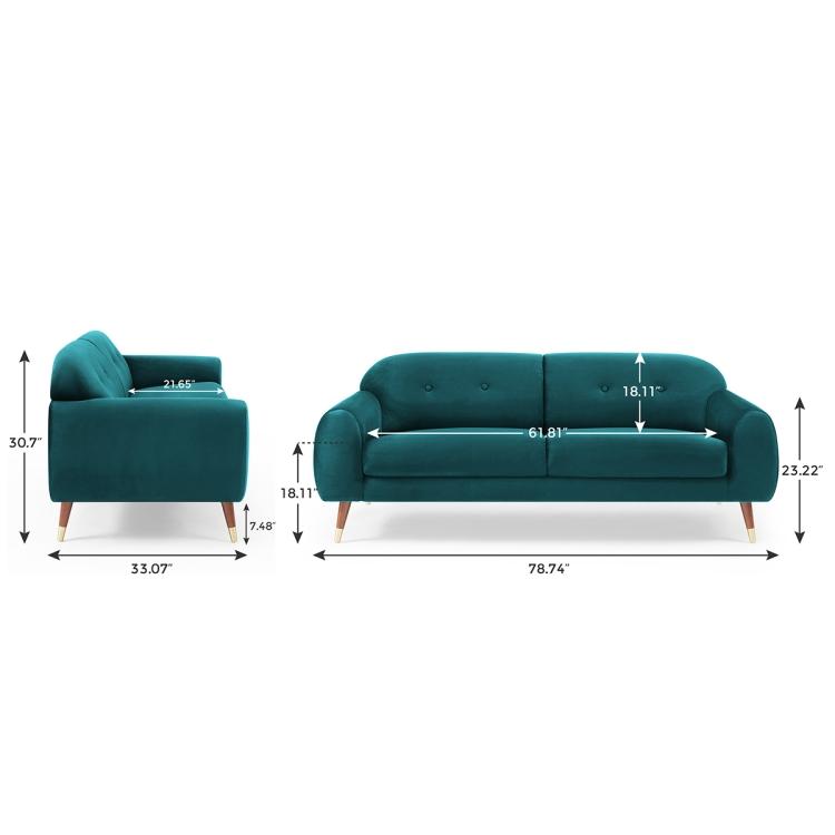 A Velvet Two-seat Sofa with Wide Flared Armrests in front of a white wall.