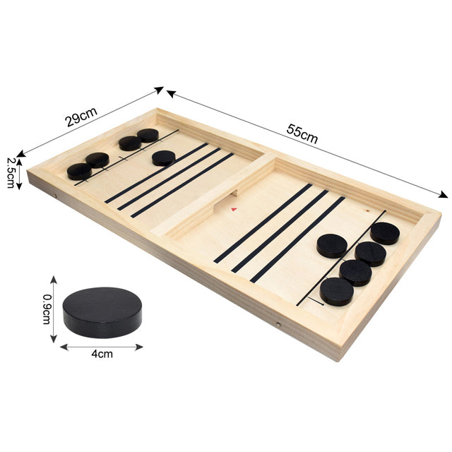 A person is playing a game of Sling Puck Table Hockey Game on a wooden board.