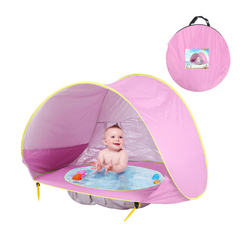 A Waterproof Baby Beach Tent with a baby in it by ModernMazing.