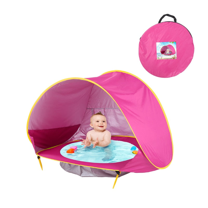 A Waterproof Baby Beach Tent with a baby in it by ModernMazing.