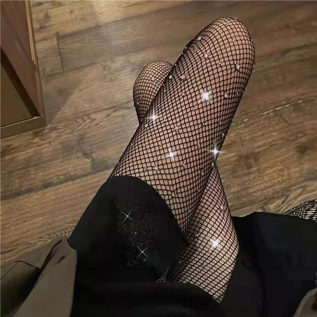 A rebellious woman wearing Edgy Elegance fishnet stockings and black boots.