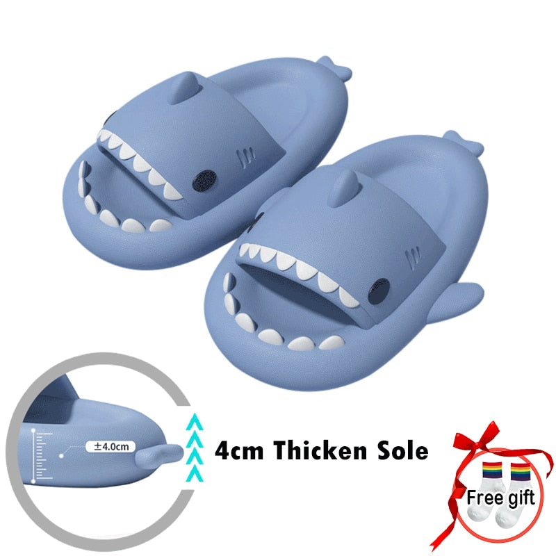 A pair of ModernMazing Premium Shark Slides - Super Soft, Comfy, Silent, & Anti-Slippery on a beach with palm trees.