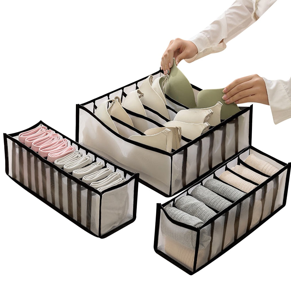 A woman is putting clothes in a ModernMazing Wardrobe Clothes Organizer.