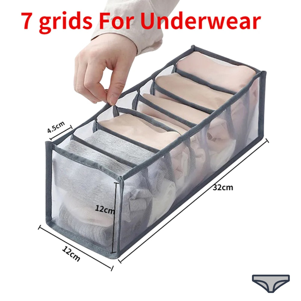 A woman is putting clothes in a ModernMazing Wardrobe Clothes Organizer.