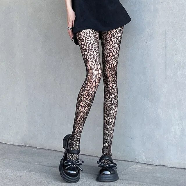 A sensuous woman wearing Seductive Silhouette Faux Thigh High Stockings and black shoes.