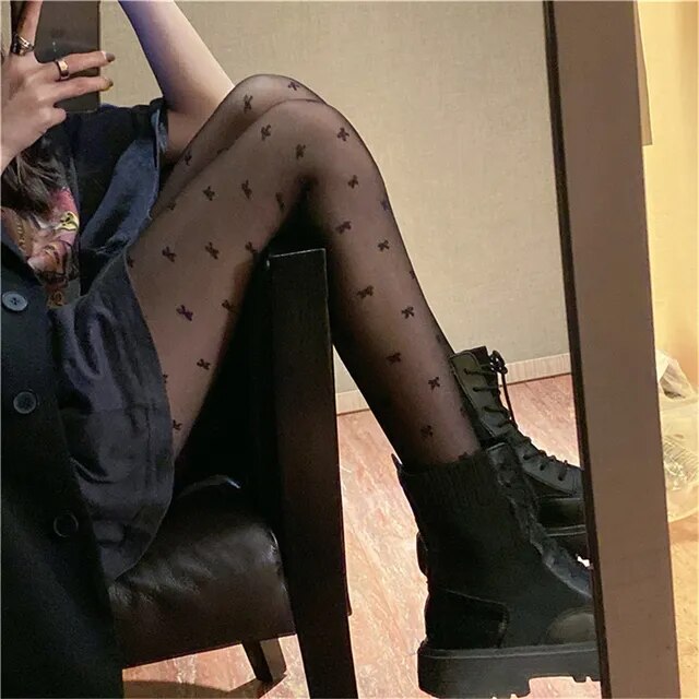 A sensuous woman wearing Seductive Silhouette Faux Thigh High Stockings and black shoes.