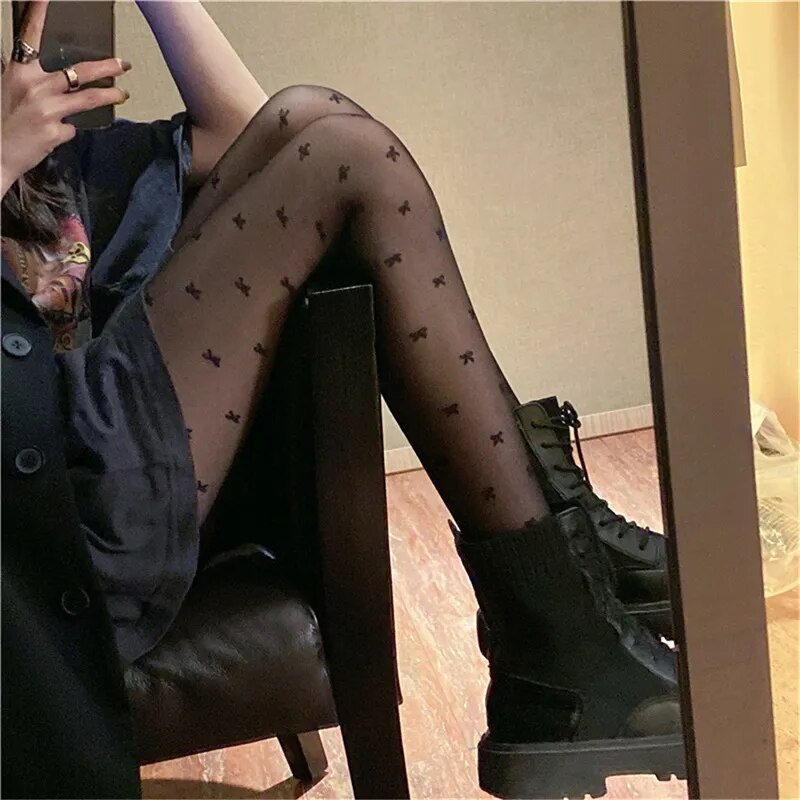 A sensuous woman wearing Seductive Silhouette Faux Thigh High Stockings and black shoes.