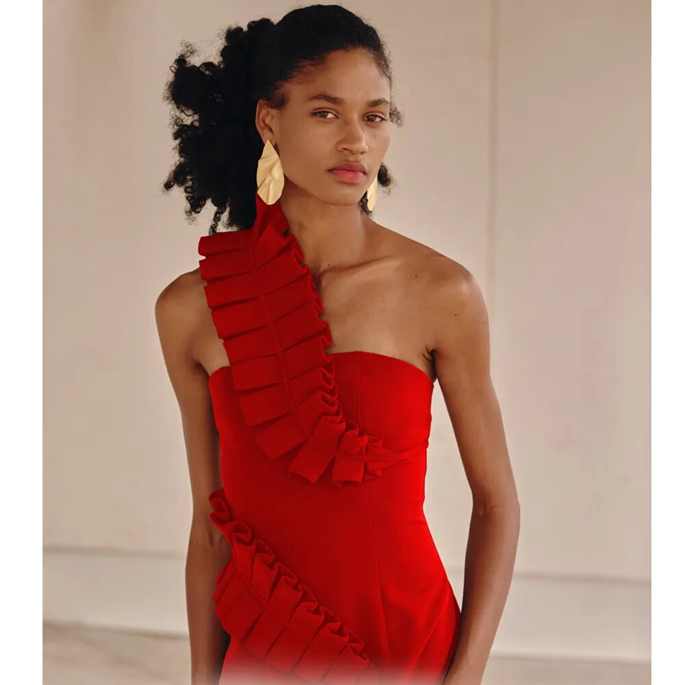 A woman wearing the Sultry Elegance: One-Shoulder Midi Bandage Dress with ruffled slits eligible for Returns and Money Back Guarantee.