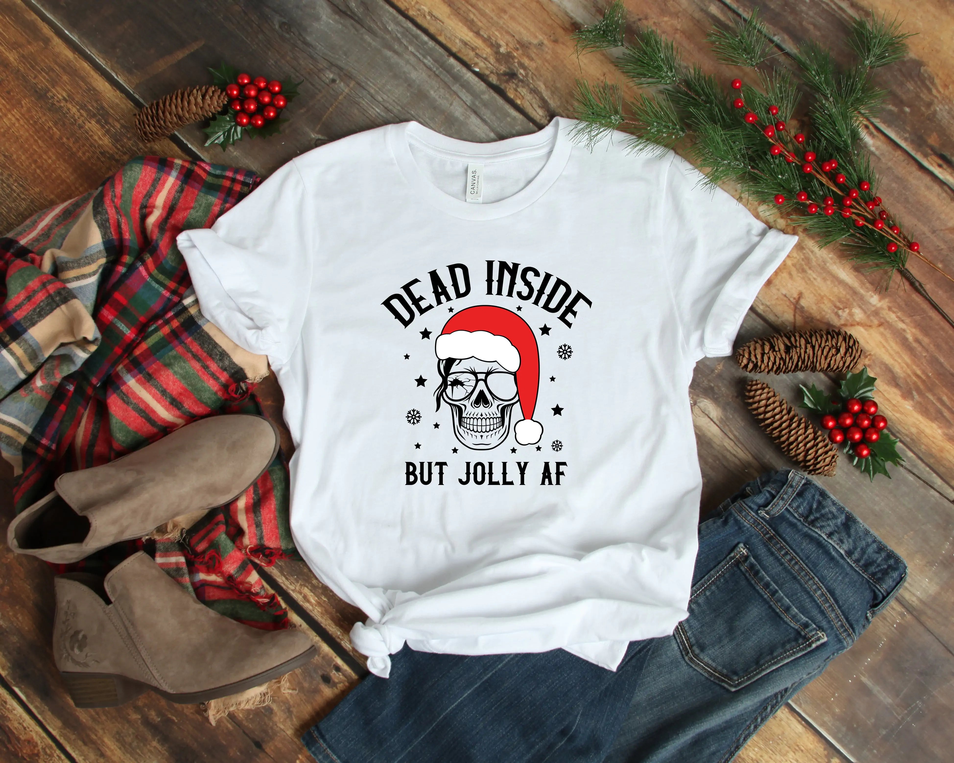 A festive Dead Inside But Jolly AF Christmas Skeleton Shirt with holiday decorations and casual attire, available in unisex sizes.