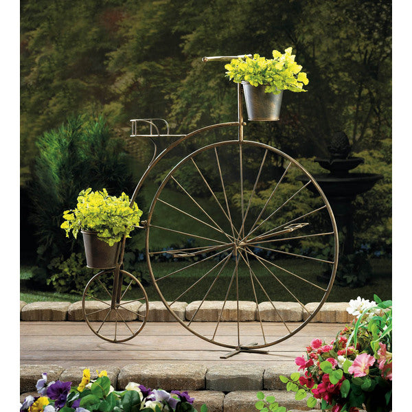 A Summerfield Terrace Vintage-Style Bicycle Plant Stand with a flower pot on it.