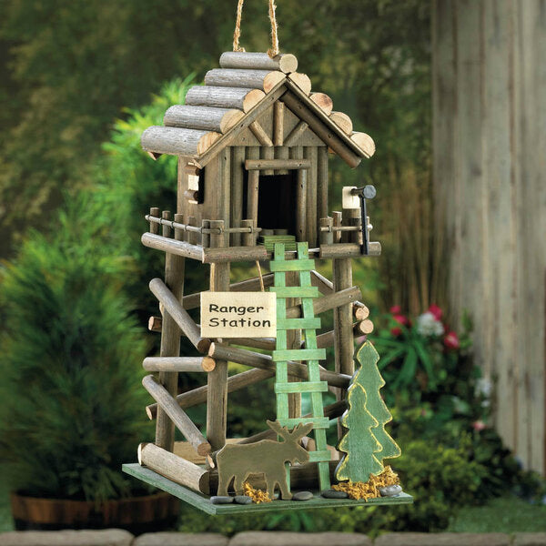 A Songbird Valley Wood Ranger Station Bird House with a ladder and a sign on it.