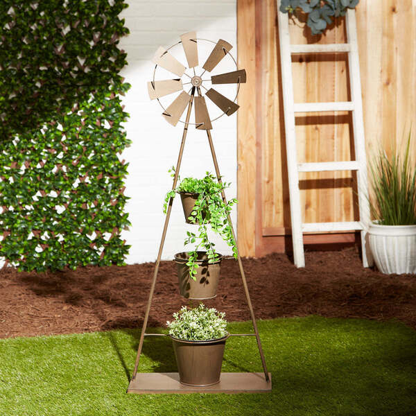 A Summerfield Terrace Metal Windmill Plant Stand with three pots and a windmill.