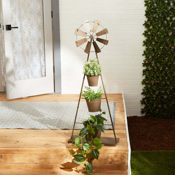 A Summerfield Terrace Metal Windmill Plant Stand with three pots and a windmill.