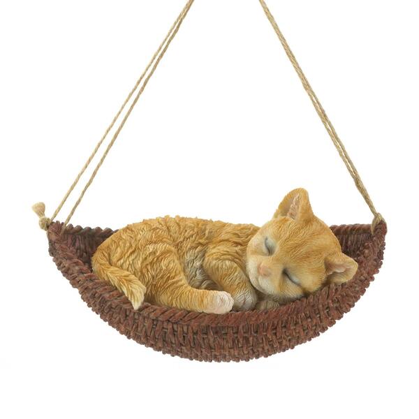 A Summerfield Terrace Napping Kitten on Hammock Hanging Figurine sleeping in a hammock.