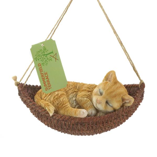 A Summerfield Terrace Napping Kitten on Hammock Hanging Figurine sleeping in a hammock.