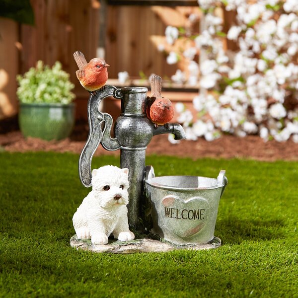 A Summerfield Terrace Terrier Puppy with Birds Solar Garden Light with Flower Pot and bird sitting on a watering can.