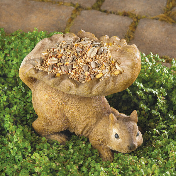 A Songbird Valley Squirrel's Tail Bird Feeder with a bag of seeds on its back.