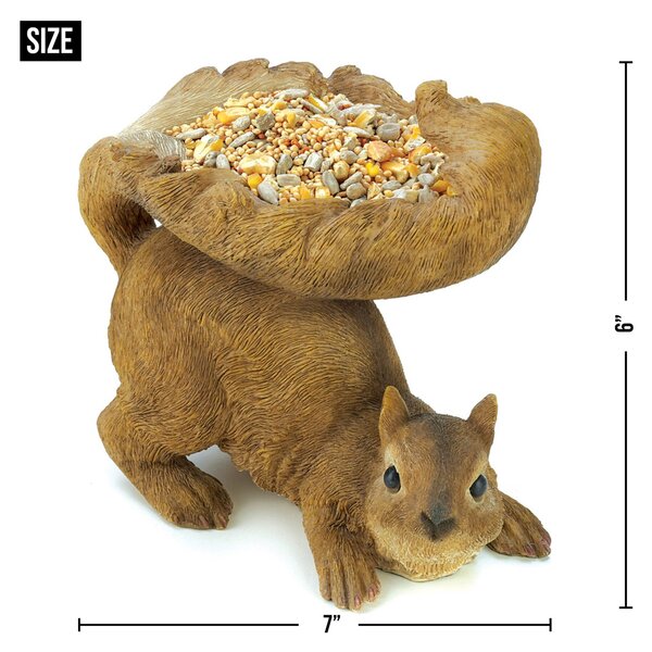 A Songbird Valley Squirrel's Tail Bird Feeder with a bag of seeds on its back.