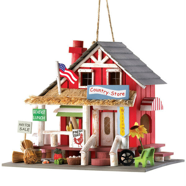 A Songbird Valley Wood Country Store Bird House with an american flag on it.