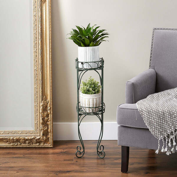 A Summerfield Terrace Scrolled Verdigris Two-Level Plant Stand with two tiers.