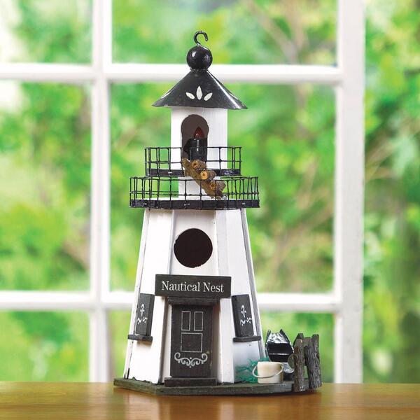 A Songbird Valley Nautical Nest Wood Lighthouse Bird House with a lighthouse on it.