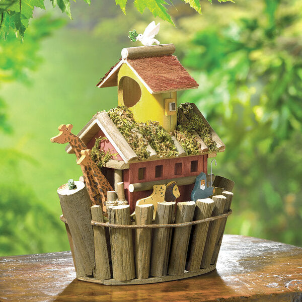 A Songbird Valley Noah's Ark Birdhouse with a giraffe in it.