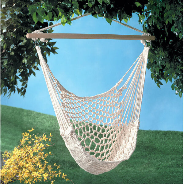 A Summerfield Terrace Recycled Cotton Swinging Hammock Chair hanging on a wooden frame.