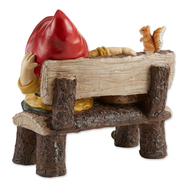 A Summerfield Terrace Garden Gnome and Squirrel on Welcome Bench sitting on a log with a welcome sign.