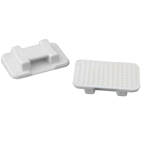 A pair of white plastic handles on a white surface. These handles are designed to withstand the pull strength of 150 lbs. and can be secured using a Weld Mount AT-5 Large White Nylon Wire Tie Mount - Qty. 100