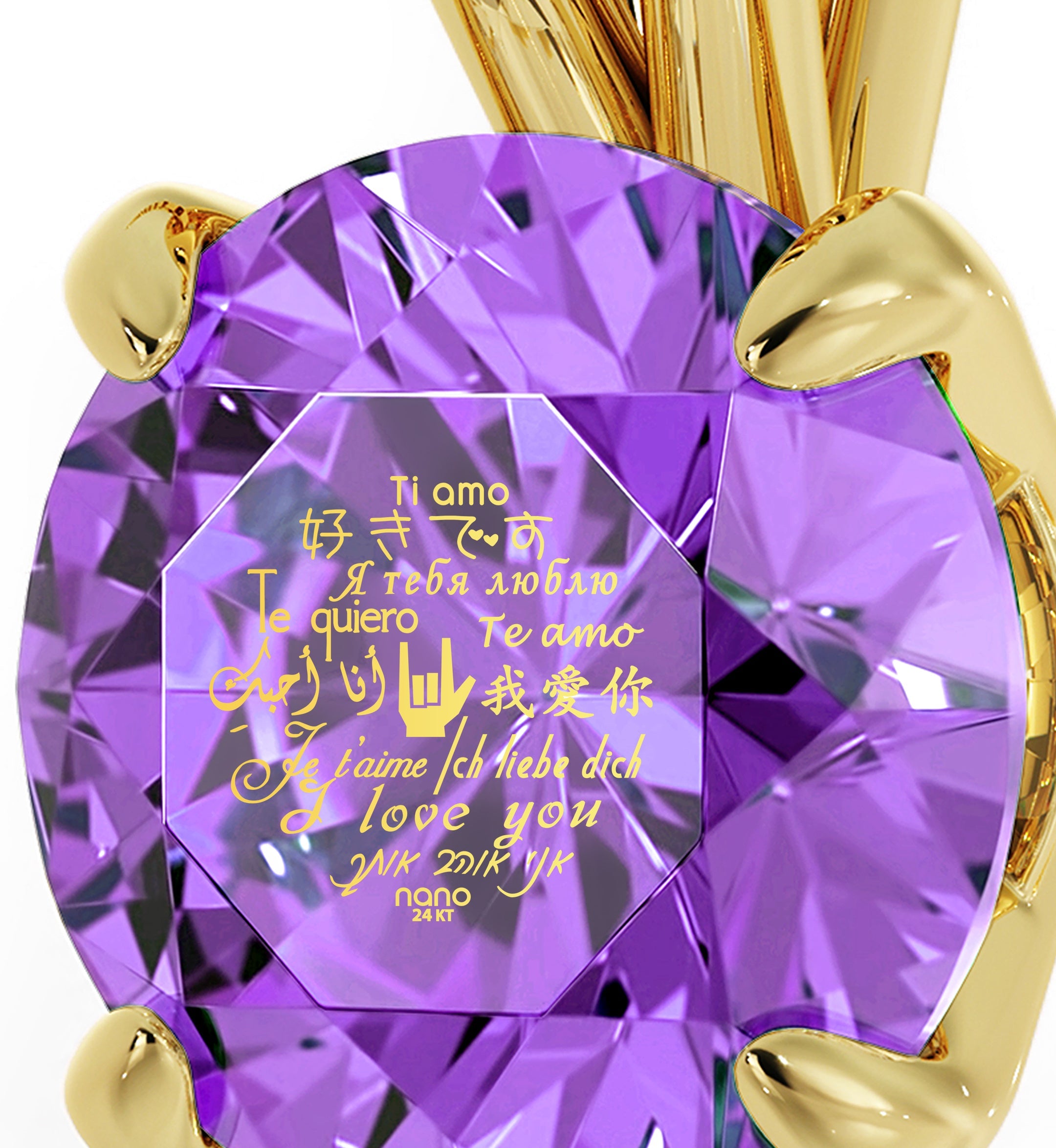 A close-up of a large Swarovski crystal held by a gold prong setting, with Gold Plated Silver I Love You Necklace Solitaire Pendant 12 Languages 24k Gold Inscribed written in multiple languages overlaying the gem.