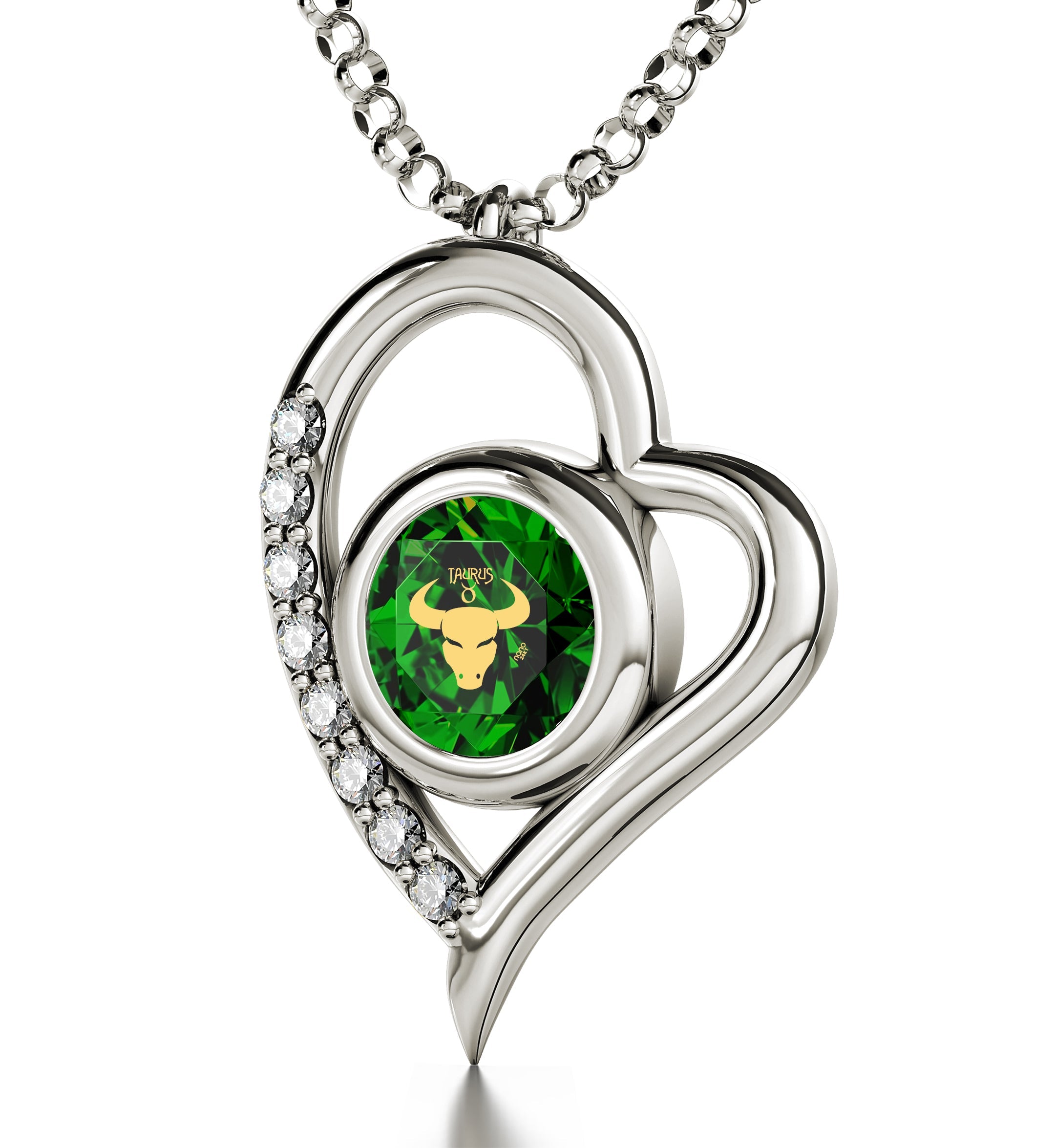 Close-up of a 925 Sterling Silver Taurus Necklace Zodiac Heart Pendant 24k Gold Inscribed on Crystal depicted in gold on a green geometric background, set in a silver ring encrusted with diamonds and featuring Taurus zodiac jewelry elements.