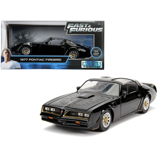 A Tegos 1977 Pontiac Firebird Black "Fast & Furious" Movie 1/24 Diecast Model Car by Jada in a box.