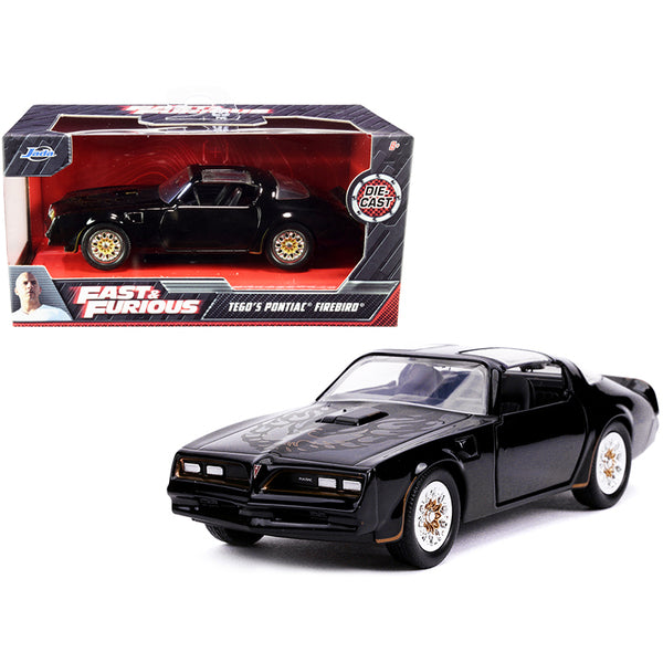 Tego's Pontiac Firebird Black with Gold Stripes and Hood Bird "Fast & Furious" Series 1/32 Diecast Model Car by Jada.