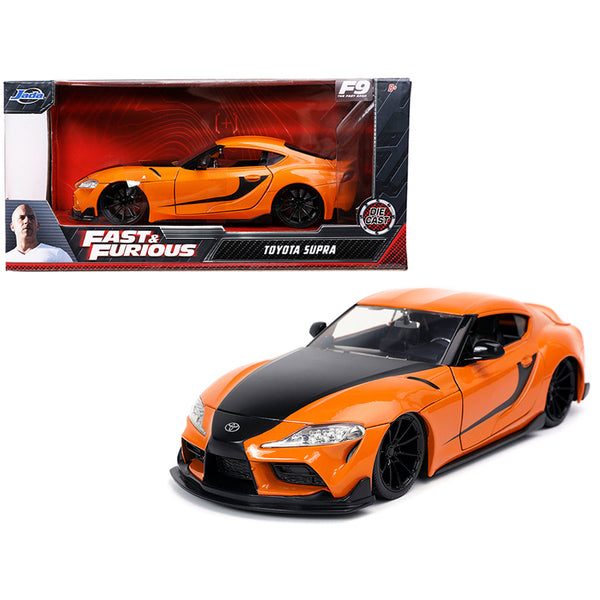 A Toyota Supra Orange with Black Stripes "Fast & Furious 9 F9" (2021) Movie 1/24 Diecast Model Car by Jada in a box.