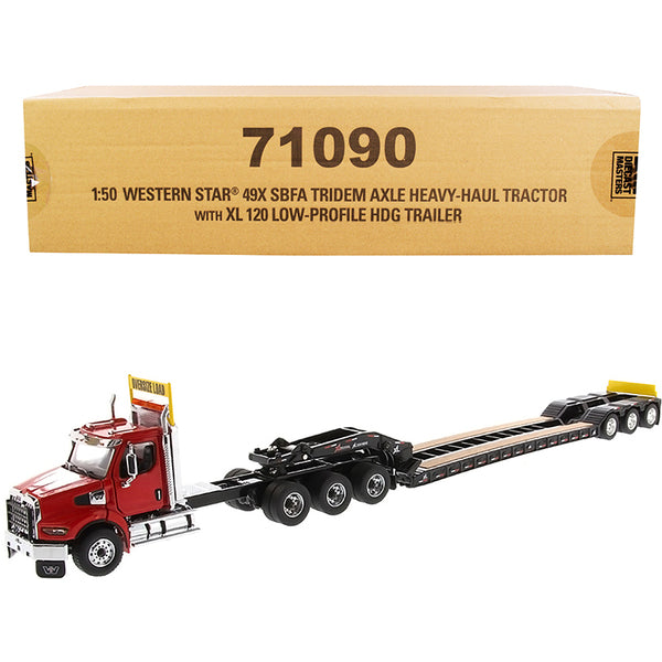 A Western Star 49X SBFA Tridem Axle Heavy-Haul Tractor with XL 120 Low-Profile HDG Trailer Red and Black "Transport Series" 1/50 Diecast Model by Diecast Masters with a box on it.
