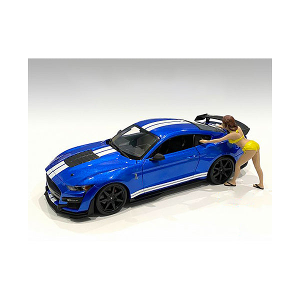 A Stephanie Bikini Car Wash Girl Figurine for 1/18 Scale Models by American Diorama is standing next to a blue ford mustang.
