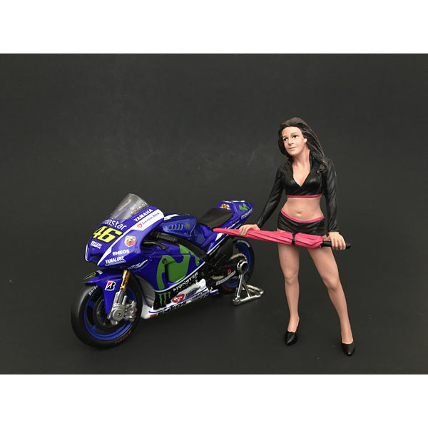 A model of Umbrella Girl I Figure For 1:24 Scale Models by American Diorama standing next to a motorcycle.