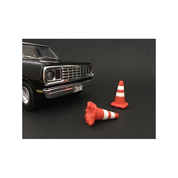 A black toy car with the Traffic Cones Set of 4 Accessory For 1:24 Models by American Diorama next to it.