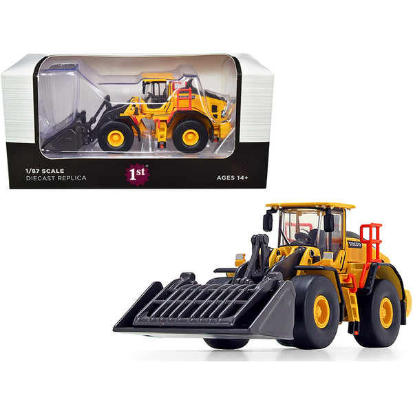 A model of the Volvo L180H Refuse Wheel Loader 1/87 (HO) Diecast Model by First Gear in front of a box.