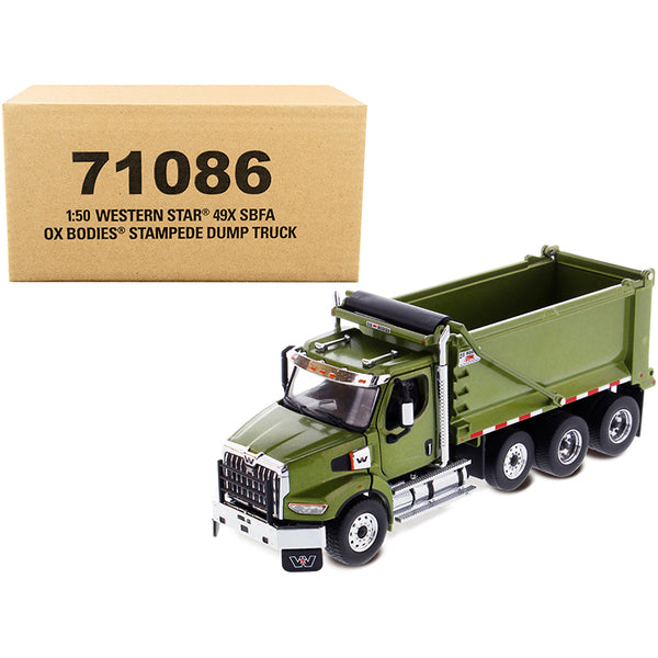 A Western Star 49X SBFA OX Bodies Stampede Dump Truck Olive Green Metallic "Transport Series" 1/50 Diecast Model by Diecast Masters next to a box.