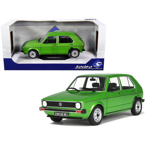 A toy Volkswagen Golf L Viper Green Metallic 1/18 Diecast Model Car by Solido in front of a box.