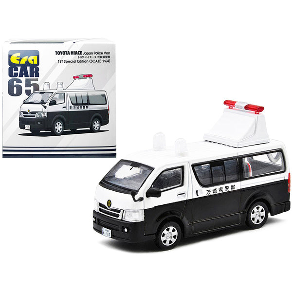 A Toyota Hiace Japan Police Van White and Black "1st Special Edition" 1/64 Diecast Model Car by Era Car in front of a box.
