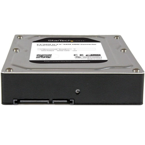 A StarTech.com 2.5" to 3.5" SATA Aluminum Hard Drive Adapter Enclosure with SSD / HDD Height up to 12.5mm on a white background.