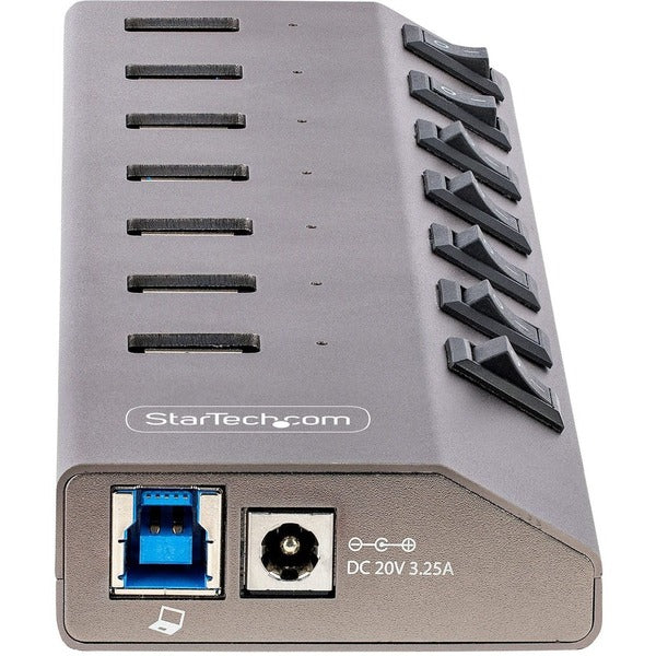 Four StarTech.com 7-Port Self-Powered USB-C Hubs with Individual On/Off Switches, Desktop/Laptop USB-C to USB-A Hubs, USB Type C Hubs w/Power Supplies on a silver plate.