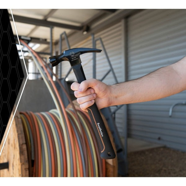 A person using a Southwire BMEH-20 Hammer to hammer a piece of wood.